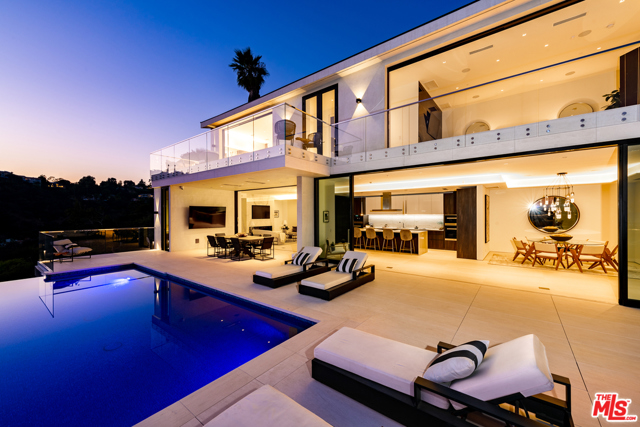 1037 Stradella Road Los Angeles, California Perfectly situated in prime Bel Air, sits this pristine, newly-built, contemporary masterpiece. Enter into the expansive, serene and open floor plan which provides abundant space throughout along with explosive canyon, ocean, and city views. Designed with dramatic indoor and outdoor flow, including a massive 3,000 square foot outdoor patio set with a refreshing infinity pool, which is perfect for entertaining. Take note of the imported Italian marble from Antolini, beautiful Italian limestone floors, Oak wood floors, Fleetwood doors and Lutron Lighting system. The custom Italian kitchen was designed by Aran Cucine and outfitted with Miele appliances. The elegant master bedroom suite has a private balcony along with 5 additional en-suite bedrooms all offering wonderful views. The property includes a theater, game lounge, wine cellar, home office, plenty of space for a gym and second office. This is a wonderful opportunity to own an immaculately designed, organic, and private retreat.