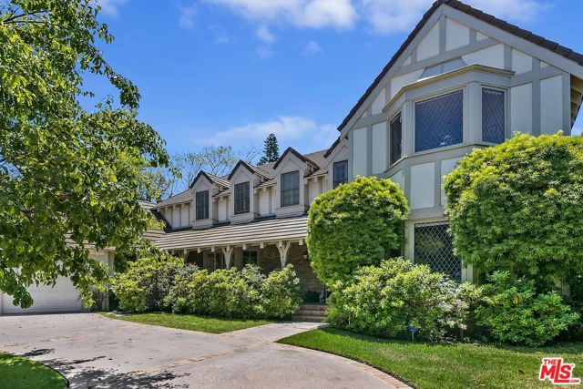 16706 Monte Alto Place Pacific Palisades, California Spectacularly sited on a cul-de-sac in the Palisades Hills HOA, this elegant Country English home provides expansive mountain views and a peek of the ocean. The spacious, formal entry leads into a den looking out toward the front and the formal living room with fireplace and views to the rear yard and the mountains. Gracious public rooms also include the large family room with fireplace and French doors to the rear yard, an elegant formal dining room and a powder room. The kitchen provides a center island, stainless appliances and a breakfast bar in addition to a breakfast room that has a warming drawer and 2 refrigerated drawers. There is a large laundry room with direct access to the 3 car garage plus a bedroom and bath on the main level. Above the garage there is a huge room that could be used as an office or studio. There is an enormous master suite with fireplace, walk-in closet and views to the ocean plus two bedrooms that share a bath and an additional bedroom suite. There are wood floors throughout the main level. The vast and open, grassy backyard provides wonderful entertaining patios, a swimmer's pool and spa and enjoys extensive views of the mountains.