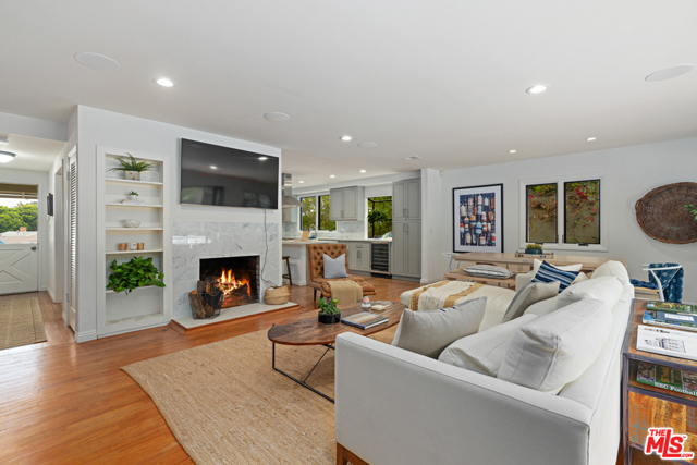 3021 Linda Lane Santa Monica, California Welcome home to this sophisticated home in the heart of Sunset Park! Nestled in an ideal location atop a cul-de-sac like, loop street, this light-filled home sits on a sprawling 8,200+ sqft lot. Settle into this tranquil oasis and have the opportunity to expand later. //About this home: Enter into this spacious home with a functional floor plan for optimal comfort and style. Truly an entertainers dream, the chef's kitchen has been extensively renovated with a refined modern aesthetic and includes, state-of-the-art appliances, a wine fridge, and a walk-in pantry with a charming, sliding barn door. With a seamless flow for entertaining, the kitchen extends to the dining area and family room, with the wood-burning fireplace as its centerpiece. Enjoy a family meal at the dining space that looks out through the multi-bifold door that transcends you to the backyard. //You'll Love: Hosting friends and family or just lounging in the magical outdoor space! Complete with a patio deck, gas fire pit, and built-in grill. Surrounded by mature orange, lemon, avocado, pineapple, and guava trees you have it all. Follow the path to the top of the backyard hill to find another sitting area that is perfect to enjoy a book. // The Neighborhood: One block from Marine Park, seconds from Ocean Park, enjoy some of LAs best coffee shops, restaurants, and boutiques!