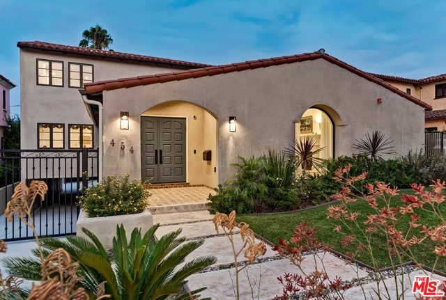 454 El Camino Drive Beverly Hills, California An extensive renovation and remodel in 2017 created this elegant 2 sty Spanish with curb appeal on a coveted quiet road just south of Olympic and west of Beverly Dr. Sunlit rooms with tasteful wood floors, mouldings, and high ceilings. Gracious entry way seamlessly flows into all of the public spaces. Huge living and dining rooms for superb entertainment capacity. Knockout kitchen with top stainless appliances and walk-in pantry overlooks a generous family room opening to the rear yard with a new pool/spa and patios. Grand master suite upstairs with sitting area/two walk-ins/vaulted ceilings/balcony/peek-a-boo hillside views/stunning bathroom. 2 other guest suites upstairs along with a fourth bedroom suite downstairs. All bedrooms are 'en suite' and exhibit tasteful new bathrooms. This is the gem for which you have awaited in southwest Beverly Hills.