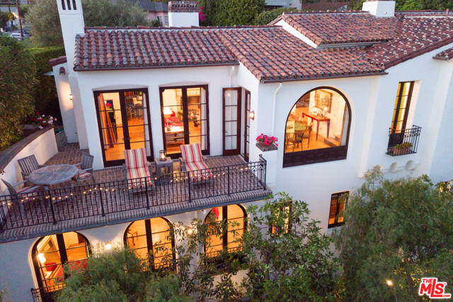 267 Amalfi Drive Santa Monica, California Las Casa Amada... Beloved Home. The Mansionette on lower Amalfi Drive. A rare, one of a kind art piece by Kevin A. Clark. This crown jewel of Santa Monica Canyon is situated on a sun-drenched south-facing, hillside lot and looking across the canyon toward Adelaide Dr. & out to the blue sea. The gated & hedged property is an explosion of period details inside & out. Plaster interior walls, Malibu tiles, bespoke millwork, cabinetry & wrought iron, with 2 masonry, wood-burning fireplaces. The grounds are lushly landscaped with mature plantings creating a wonderful private oasis. Designed by Clark & built by top LA builder JD Group, Inc. to feel as though you are living in an early 20th-century home, yet constructed with the highest standards, technology and finishes of early 21st Century. A fantastic family home, or your super luxury Los Angeles beach town Pied-a-terre. La Casa Amada entertains on a grand scale while acting as your warm and cozy nest. Find your path home to La Casa Amada