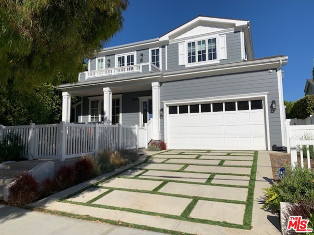 608 N Las Casas Avenue Pacific Palisades, California Gorgeous and spacious Cape Cod Home constructed in 2018 with sparkling pool, spa, waterfalls, and Baja shelf. The yard also has a fire pit with built-in seating area. This 4,341 home features 5 bedrooms plus 6 bathrooms and sits on a 6,731 square foot lot. The living room has a fireplace and lovely built-in cabinets. There is a formal dining room that opens to a butler's pantry. The kitchen features quartz countertops, a full size refrigerator and full size freezer, cooks range, built-in microwave, dishwasher, built-in ice-maker, and large center island with breakfast bar. The breakfast area has built-in seating. The family room features a fireplace, built-in cabinets, and electric window treatment at the sliding glass door. When you go upstairs, there is a loft with bar featuring a wine refrigerator and sink. The sumptuous master suite with vaulted ceilings has a fireplace, balcony, and lovely view. The master bathroom has double vanities, large shower, separate tub, and walk-in closet with built-ins. All bedrooms have en-suite bathrooms. This smart home has a security system, built-in speakers, and SONOS stereo system inside and outside. There are hardwood and tiled floors, recessed lighting, a garage with Tesla charger, plus solar panels purchased and paid in full. No rental agreements. This home is really special!
