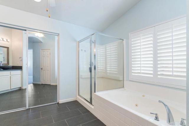 Primary bathroom with separate tub and shower