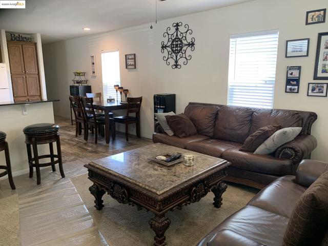 Living area featuring plenty of natural light and recessed lighting