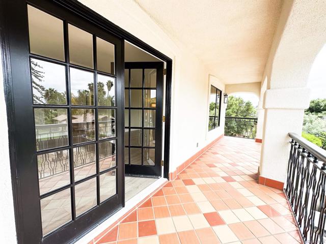 Primary bedroom balcony overlooking front yard