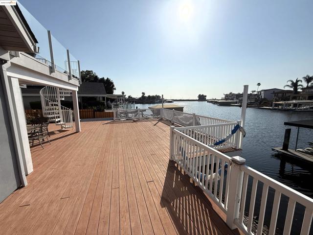 Wooden terrace featuring a water view