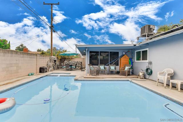 Pool in foreground with patio in the background