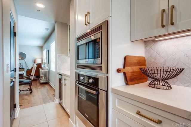 mini butlers area with wine fridge, cocktail or coffee area and walk in pantry