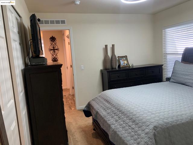 Bedroom with carpet flooring and baseboards