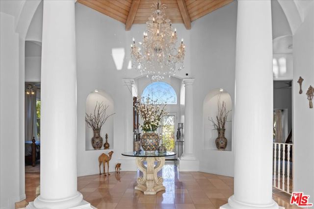 Grand entrance with large white pillars