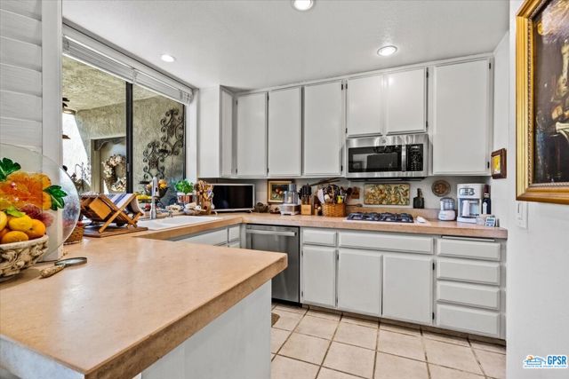 Updated kitchen with limestone counter tops...