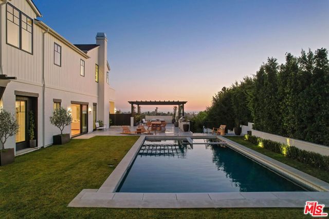 15975 Alcima Avenue Pacific Palisades, California Incredible value with built-in equity! The home appraised for $23,000,000 in 2022. Immerse yourself in the quintessential Southern California lifestyle as you enter this oasis-like compound, where deluxe finishes and an open-concept floor plan accentuate the unparalleled sunrise to sunset ocean views. This custom-built contemporary farmhouse is set upon almost an acre of land, boasts 7 bedrooms, 12 bathrooms and is located just minutes away from the Palisades Village. Perched at the top of a private driveway, this home is secluded and is the ultimate wellness & entertainment residence. The floor-to-ceiling doors open to the outdoor vacation-like yard featuring a large heated pool and spa paired with a cabana, and a space for alfresco dining. You are welcomed with endless natural light that floods into the 11-foot ceilings living areas. The main level includes: a state-of-the-art chef's kitchen with an attached butlers pantry, a temperature-controlled wine cellar, a chic office, and a wellness retreat equipped with a steam shower and infrared sauna. Each room flows effortlessly into the well-manicured backyard. Ascend to the extravagant primary suite that boasts an incredible unobstructed ocean view completed with an expansive balcony, a luxury fireplace, two vast closets, spa-like baths, and vaulted ceilings. On the other wing, there are four generous secondary bedrooms which complete the top floor. Enjoy limitless amenities such as an elevator, an oversized theater, gym, lower-level guest quarters, dual-level laundry rooms, and a four-car garage. Cozy up to the outdoor fireplace on the upper deck and relish in the panoramic views of the ocean to the lush hillside. This brand new estate was imagined by Los Angeles' exclusive luxury development group, Palisades Development Company, the property evokes grand, traditional allure throughout with a bonus of community charm. Don't miss out on this once-in-a-lifetime opportunity!