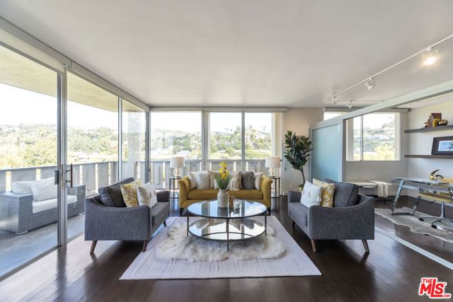 4455 LOS FELIZ Boulevard 708 Los Angeles, California Views views views!!! Stunning North west facing unit with unobstructed views of the Hollywood Hills and the Griffith Observatory. Enjoy this beautifully updated 2 bedroom 2 bath condo with floor to ceiling windows with a wrap around balcony perfect for indoor outdoor living. Unit features hardwood floors throughout and an updated kitchen with stainless steel appliances. Building has 24 hour security staff, pool, spa, and a fully equipped gym. HOA covers cable TV and internet service.