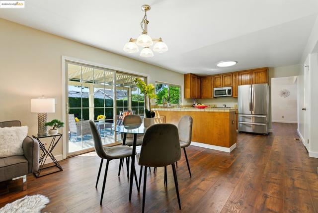 Dining room featuring a chandelier and dark wood-type flooring