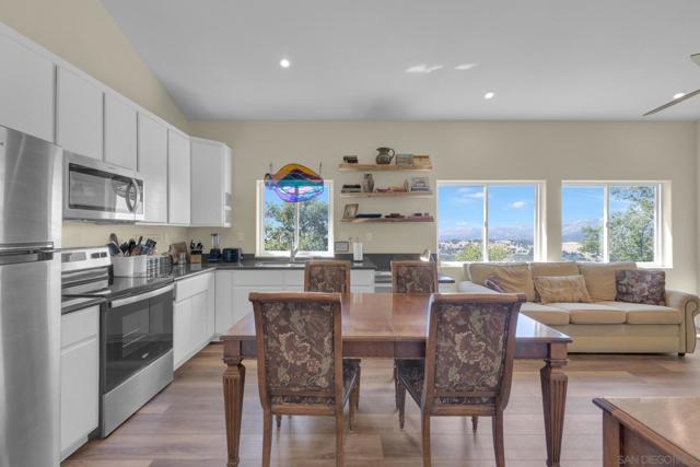 The open, airy kitchen with updated stainless-steel appliances.