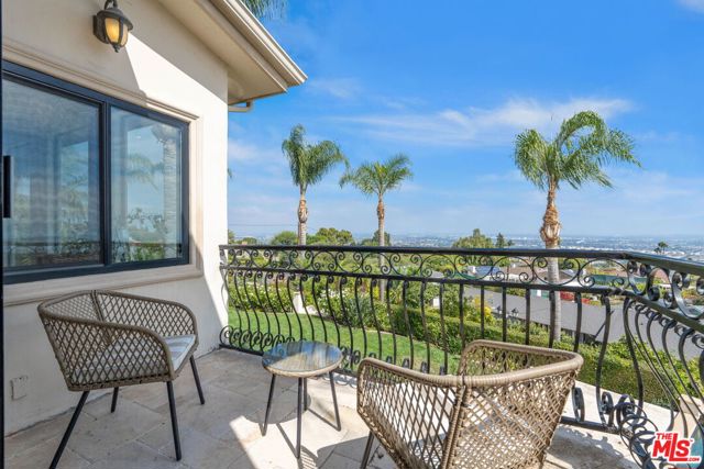 Balcony overlooking backyard a