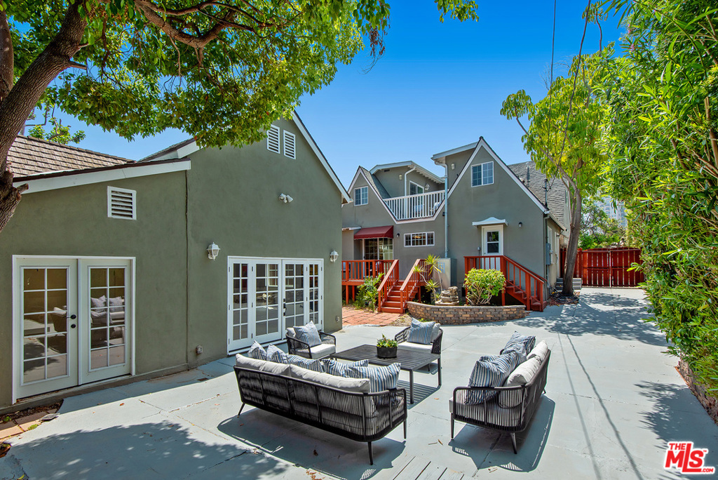 1312 Woodruff Avenue Los Angeles, California Warm & inviting Traditional home on a quiet Westwood street. This remodeled 6 bed, 4 bath light filled home is full of character. Enter through the appealing front patio complete with mature trees & new landscaping. Large living room with coved ceilings, curved doorways, gas fireplace, surrounded by built-ins. Separate dining room. Kitchen with double oven, breakfast area & greenhouse window. 3 downstairs beds with 2 baths, and access to back deck. 2nd story family room with vaulted ceilings, recessed lights, skylight & access to outside balcony. Step up master bed also with pitched ceilings & skylights and an updated 4 piece master bath with jetted tub. 2 additional beds & bath upstairs. Private backyard with deck & converted garage that offers bonus space. Laundry room off the kitchen, Wood & tile floors throughout. Driveway parking for 3-4 cars. Huge backyard concrete area; great for parties or kids riding toys. Close to places of worship. Fairburn Ave School. Safety protocols will be enforced. --- This property also presents itself as an investment opportunity with the current configuration of an ADU in the garage structure. See agent for details. Potential monthly income is estimated to be between $12,000 and $14,000.