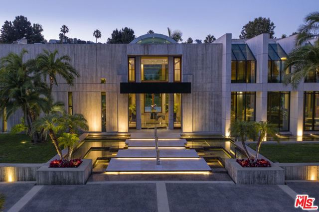 601 MOUNTAIN Drive Beverly Hills, California "The Glazer Estate" World Class Modern + World Class Location. Approximately 27,500 sqft. carefully curated with no expense spared. Located on the most prime Estate section of Beverly Hills, Mountain Drive is perhaps the best street in the city. Over 1.6 acres level in a park like setting,with a long private driveway, rolling lawns and a 98 ft. swimmer's pool. Entertain on a grand scale with the capability to host over 1,000 guests. Highest level of quality throughout includes board form concrete, teak doors and windows and theatrical water elements. Massive scale with two-story glass atrium/foyer, grand Formal Dining Room, glass enclosed Junior Dining Room and Formal Living Room. Exceptional "water lounge" surrounded by ponds on all sides. Lavish master suite with dual baths and closets. Additional features include an indoor pool and ballroom. A world apart in the heart of Beverly Hills, North of Sunset Blvd.