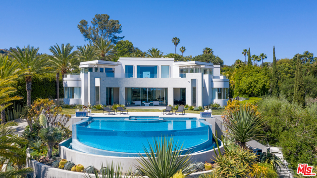 1108 TOWER Road Beverly Hills, California Located on very prime lower Tower Road, just 2 minutes behind the Beverly Hills Hotel. Beautifully situated at the top of a long gated private driveway, this spectacular modern masterpiece was designed by Richard Landry with no expense spared. The absolute highest level of quality, with explosive city views and rare amenities on nearly a one-acre lot. Entirely newly rebuilt contemporary estate, perfect California living, sliding walls of glass open to indoor/outdoor entertaining with expansive yard, patio/grass space, outdoor dining, firepit, walking paths and incredible infinity pool overlooking city to ocean views. The entire top level features an incredible master suite with dual baths, walk-in closets and a sprawling balcony. Very dramatic 30 ft entry features a Zaha Hadid designed floating wall. Large living room, dining room and gourmet kitchen, gorgeous bar, wine cellar, professional theater, office, and spa/massage/sauna facilities. An incredible value and rare opportunity!