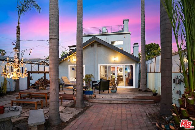 642 California Avenue Venice, California Luxury Live Auction! Bidding to start from $2,300,000! Welcome to Venice where SoCal living thrives with this rare opportunity to own a 3 story income property in Venice with ocean views. Experience the vast outdoor entertainment space this property has to offer year-round. This 3 unit income property, comprising of a duplex plus converted garage ADU is perfect for anyone looking to earn extra passive income while living steps away from the heart & soul of the Venice Beach community. Walking distance to the canals, Abbot Kinney, & blocks from the beach this property is a once in a lifetime opportunity. The downstairs front unit is a huge one bedroom, two bath with remodeled kitchen, fireplace, living room & a deck that opens to sprawling front yard. Back unit is a permitted large single unit (ADU) with its own private entrance, kitchen & laundry. Upstairs is a two story open floor plan loft unit with a see through fireplace, two decks, including rooftop deck with ocean views! Set back behind a private gated entrance this oasis is surrounded by palm trees, mature landscaping, fire pit & plenty of seating space to entertain all year round. PROPERTY WILL BE DELIVERED VACANT AT CLOSE OF ESCROW. ADU/Garage conversion was done to code and with permit. Buyers to verify all facts independently. Washer/Dryer in each unit, appliances included.