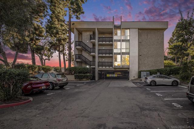 Exterior Assigned Parking Space and Gated Underground Garage. Pedestrian entrance into building adjacent to unit.