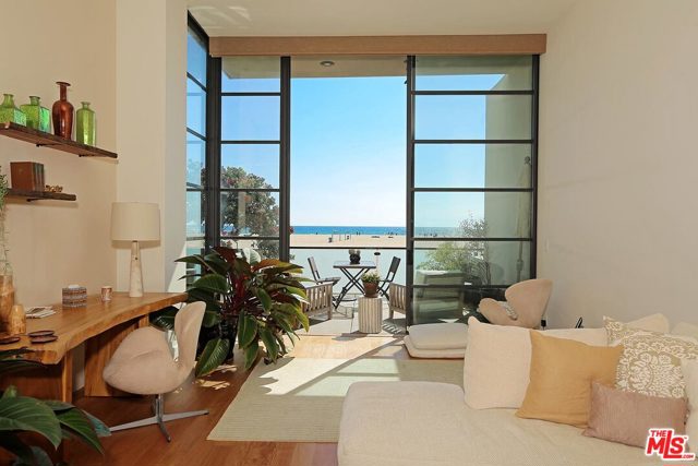 Live like you are on vacation all year round! Beachfront architectural loft style home on border of Venice and Santa Monica. Available furnished or unfurnished. 3 bedroom, 4 bath features ocean and beach views with a terrace off living room to watch the surf.  Very zen space with large cook's kitchen and breakfast room, dining room off kitchen and open staircase so one can feel the ocean breeze throughout the main level when glass sliders are open.  Truly California living at it's best!  The master bed faces the ocean view- wake up to this magic every day and count your blessings!  The lower level is currently used as a studio - could be media room or extra lounging space.  There is also a bedroom suite on the lower level for added privacy.  The main level features the large living area with fireplace, dining room and kitchen with breakfast area.  Upstairs has master suite w/ fireplace, ensuite lovely bathroom w/ steam shower & tub. oversized 2 car garage and additional parking space.
