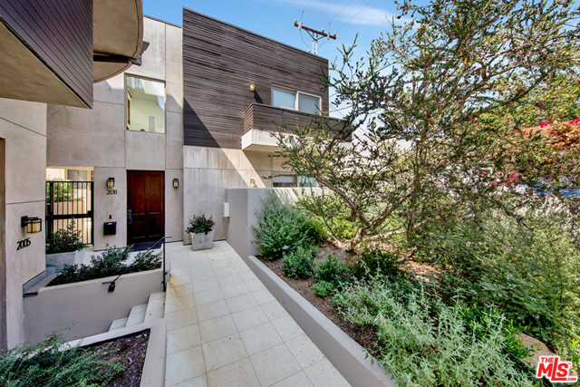 2011 Idaho Avenue 6 Santa Monica, California Built in 2008 ,this light and bright Santa Monica Townhome with no common walls and a direct access, private garage with electric car charger offers privacy and luxury. The main living room's spacious, open floor plan with hardwood floors, and floor to ceiling windows flows into the newly remodeled kitchen with gleaming white counters and Miele appliances and Sub Zero fridge. Down the hallway are the 3 bedrooms ( all corner rooms with tons of natural light) and 3 upgraded baths, including the master bath with new double sinks, new shower and tub. These "private" rooms with their balcony's, walk-in-closets and fireplace make this home the perfect oasis from the daily hustle and bustle. A lower level bonus room is perfect as a kid's playroom or could be converted into a home office or gym. Only a block away from Montana Ave. this home is prepped to be your home base for venturing out when the time comes, to all the shops, restaurants and nightlife Southern California