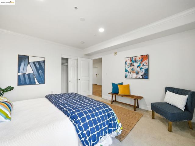 Bedroom featuring crown molding, carpet, a closet, and recessed lighting