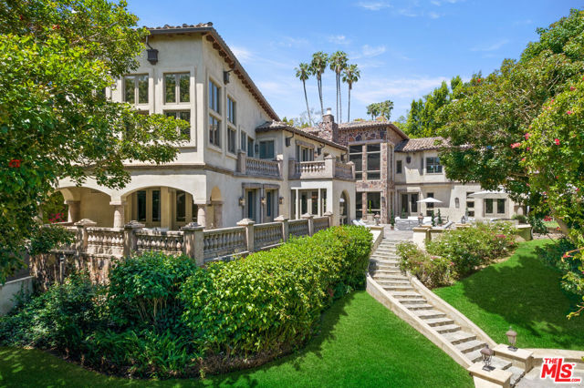 Located on one of the most exclusive streets, Carolwood Drive, in prime Holmby Hills, set amongst towering trees and hidden behind a private gated facade is this contemporary 10 bedroom, 10 bathroom Tuscany-style estate. Built of natural woods and imported stone, the romantic exterior harmonizes with the surrounding nature of towering trees and lushly landscaped verdant grounds. The finest finishes, materials and craftsmanship are featured throughout the nearly 12,000 square feet of sumptuous living space. Enter the residence to a dramatic 40-foot, two-story foyer with skylights and ornate architectural detailing. Sophisticated interiors showcase the home's bountiful scale and volume, complete with soaring ceilings, impressive archways and sizable windows and doors. Palatial hallways with luxurious marble flooring lead into the living spaces that all open to oversized stone terraces with alfresco dining, lounging areas and firepit with custom seating. Retreat into the natural light filled formal living room with fireplace and seamless indoor-outdoor living. The well-appointed formal dining room is idyllic for larger dinner parties, while an informal dining room offers an impeccable space for intimate gatherings. The Chef's kitchen complete with a sleek palate of marble and stainless steel, features a voluminous island, upgraded appliances and ample storage. Two generous family rooms offer coffered ceilings, fireplace, custom lighting, built-in shelving and fireplace. The primary mansion suite with a vaulted ceiling, double doors with garden views, a cozy seating area with fireplace and a lavish bathroom suite with custom vanity, steam rainfall shower and a chic soaking tub. The spacious upstairs en suite guest bedrooms offer ambient light and serene views. Enjoy relaxing afternoons at the private swimming pool and spa with lounge area that overlooks the immaculate, rolling grounds. Additional luxurious amenities include: a dedicated salon, recording studio, staff quarters, 3-car garage and more. Carolwood offers a rare combination of infinite entertainment, prime location and year-round indoor-outdoor impeccable living.