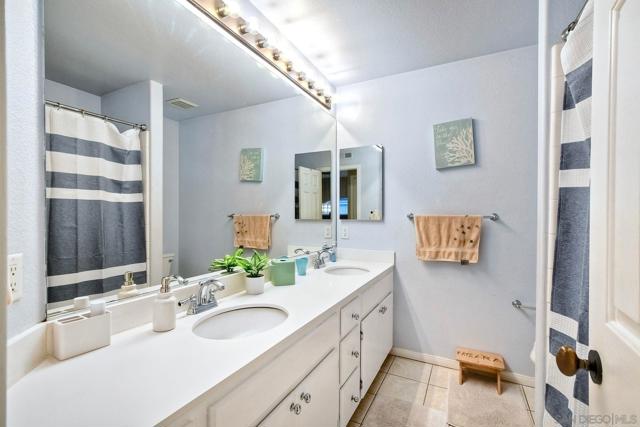 Two sinks and a lot of storage are some of the best features of the hall bath upstairs.  Tub in shower, too!