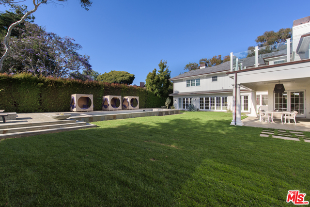 687 Amalfi Drive Pacific Palisades, California This elegant Ken Ungar design East Coast Traditional estate exudes the ultimate California luxury lifestyle. The bright open floor-plan with seamless indoor/outdoor flow is perfect for creating a comfortable living experience. Enjoy your own personal oasis in the backyard with a built-in BBQ, pool with water features, spa and fire pit. The chefs kitchen features three islands with top of the line appliances. Office/den, formal dining room, living room, pool room and maids room complete the main level. Upstairs there are five bedrooms including a kids wing with separate living/playroom. Enter the spacious master wing through a formal foyer and enjoy the sitting room and beautiful terrace with a view. The lower level features the gym, wine room, game room with bar, spectacular home theater and a guest room. Majestic mature trees make this a complete private resort, it's close to everywhere you would need to go, but you'll never want to leave.