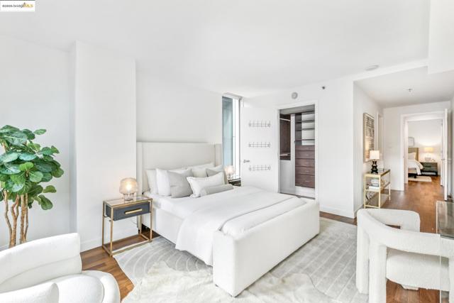 Bedroom with wood finished floors and baseboards