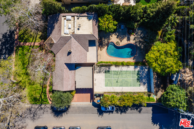 491 Homewood Road Los Angeles, California Incredible development opportunity on a premier Brentwood street. Developers, builders, and anyone looking for a once-in-a-generation chance to build your dream home, this is the one you've been waiting for! Sited on a rare, flat corner lot that's just under a half an acre with a pool and sport court, the property presents a prime opportunity to remodel or tear down, the possibilities are limitless. First time on the market in over 50 years, the 4500+ square-foot home has a formal living and dining room that both open to the backyard, a comfortable family room/den off the kitchen, and 3 bedrooms and 3.5 bathrooms on the main floor. Upstairs a large en-suite primary bedroom has a balcony that overlooks the pool and backyard, plus there's a bonus room that could be an office, playroom or extra storage. Amazing potential and fantastic location, north of Sunset in highly coveted Brentwood.