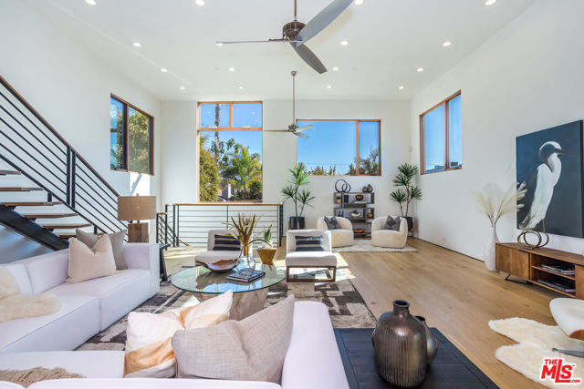 659 BROADWAY Street Venice, California Designed by highly regarded architect Robert Thibodeau, this spacious contemporary marvel is ideally situated in prime Venice close to top restaurants and boutiques on the world famous Abbot Kinney. This income producing property has endless possibilities. There are two separate units, a vacant 4 bedroom 3.5 bath in the front and a tenant occupied 3 bedroom 2.5 bath in the rear, each with their own APN. Ideal for either an owner user or an investment property. The ground floor level of the front unit offers a lounge/office plus 3 bedrooms, 2 bathrooms and a patio, while the rear unit enjoys 2 bedrooms and one bath on that level. The great room on the second floor is stunning with wide-plank hardwood floors, soaring ceilings and an open concept chef's kitchen with huge island and bar seating. Stainless steel refrigerator and freezer, separate double ovens and a 48 inch stove with additional ovens. This truly provides the ideal space for large-scale entertaining or casual living. Moving up to the third level, both the front and rear properties have primary bedroom suites equipped with a luxurious en-suite bathroom with tub, separate shower, dual vanities and well-appointed walk-in closet. Each unit enjoys an expansive rooftop providing a panoramic view perfect for capturing the sunset while enjoying the fire feature and large wood deck and lounge. The units both come with a two-car garage for a total of 4 car parking. Rents are actual for rear unit effective July 1, 2022 and projected for front unit.