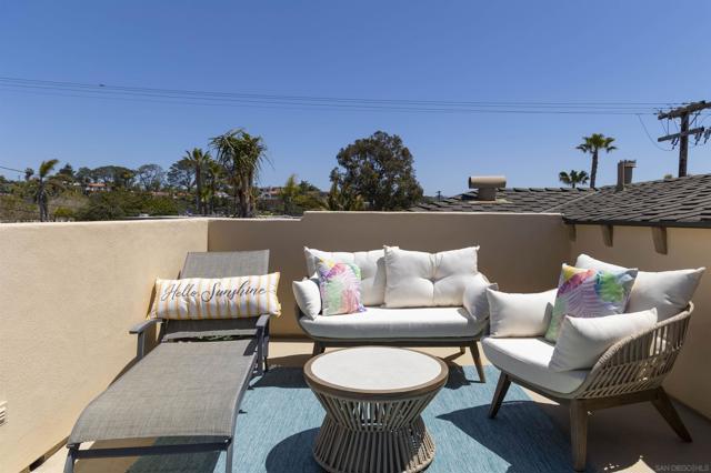 Rooftop deck offers ocean views, seating areas, bbq