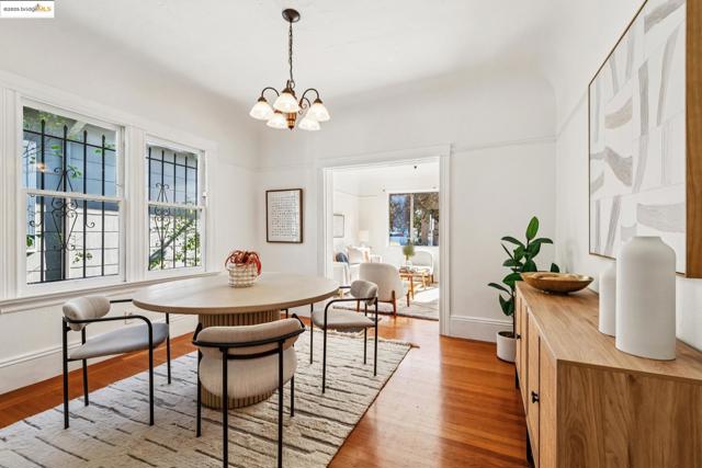 Dining area featuring light wood finished floors and a chandelier