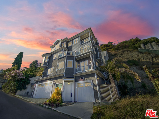 17819 Castellammare Drive Pacific Palisades, California Perfectly situated in the exclusive seaside Castellammare neighborhood. This Traditional show-stopper offers unobstructed and direct Queens Necklace ocean views to Catalina from almost every window. The four-level layout offers multiple living spaces and a host of luxurious and elegant features. The chic top-floor master with a fireplace, retreat area, walk-in closet, opens to a balcony that captures the relaxing sounds of the Pacific Ocean. The opulent master bath comes complete with a soaking tub, dual vanities, walk-in shower, and spectacular ocean vistas. An elevator connects all four levels of this luxurious residence. The gourmet kitchen features Shaker-style cabinetry, center island, a feature tile backsplash, and a suite of high-end appliances will attract the avid chef. Only a short distance to the sand and conveniently located between Malibu and Santa Monica. Come and make this paradise a reality!