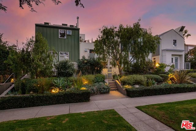938 Lincoln Boulevard 5 Santa Monica, California Stylish and sophisticated, newly remodeled Architectural masterpiece located in prime Santa Monica. Designed by award-winning architect William Dale Brantley, this one-of-a-kind stunning two-bedroom, two-and-a-half bathroom corner townhome residence has been gorgeously remodeled with incredible attention to detail and custom designer finishes. Enjoy a private and quiet rear location, (not located directly on Lincoln or an alley) with only one common wall, a large loft or flex-space (perfect for a home office, family room or playroom), a spacious, entertainers patio with plenty of room to dine, lounge and/or BBQ, lushly landscaped planters, and a private rooftop deck. Light and bright living spaces, and a dramatic multi-level plan includes soaring ceilings, skylights, wide-plank white-oak wood floors throughout and a gas fireplace with a new smooth, custom plaster surround. The gorgeous chefs kitchen features new Quartz countertops with a dramatic waterfall edge, stainless steel farmhouse sink, floating shelves, new recessed lighting and a custom built-in banquette with storage. Retreat to the incredible primary suite, a true sanctuary, with a newly updated 5-star, spa-like bathroom with new dual basin floating vanity, inviting soaking tub set in a recessed alcove with floating redwood shelving and a custom tile splash wall, along with an over-sized shower with a luxe marble finish, custom shampoo shelf, and Hansgrohe rainfall and shower wand plumbing. Additional highlights include a generous en-suite guest bedroom with new quartz top and a refinished vanity, powder bathroom, extra storage, new HVAC system with ActivTek air purification system, and a private, direct access two-car garage. Located just a stones throw to Montana Avenue, Third Street Promenade, and the beach. This is Santa Monica, luxury living at its finest.