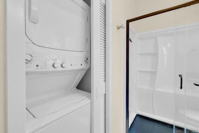 Neatly tucked away, the stacked full-size washer and dryer