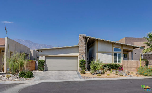 799 Spaulding Lane Palm Springs, California Warm and inviting 3 bedroom, 3 bath VIEW home located on a premier lot in Escena Country Club. This home, designed in the "mid-century" style, was built 2011 by Lennar Homes, aka as an Avant-Plan 1 residence. It encompasses the desirable feature of walking in the front door and getting an immediate WOW factor as eyes are drawn immediately to behold the panoramic sight out the back. Iconic Palm Springs indoor/outdoor living at its finest! Savor the million dollar incredible sweeping views of the golf course, mountains (including head on of Mt. San Jacinto), and the windmills. Special bonus is the ability to watch planes depart and land at PSP in the midst of the spectacular scenery. In addition: large pool with a cascading spa; great room with soaring ceilings and a wall of glass for your viewing pleasure; stacked rock fireplace; gourmet kitchen with granite countertops; stainless steel appliances; a huge island/breakfast bar and pantry; laundry room with a sink and cabinets; solar system; water softening system; tankless water heater; 2-zones of HVAC; ceiling fans; large covered patio; outdoor kitchen anchored by a built in grill; Zen-like courtyard entry; an architectural significant design and Desert landscape for easy maintenance and water conservation. Plus: large master suite with a slider that enables same vista upon awakening, double vanity, large tub and walk in shower and a walk in closet. Powder room for guests. Low HOA dues. Escena is guard gated and located on a championship golf course and the Modernist designed restaurant/clubhouse, which is open the public, is another opportunity to take in breathtaking views and good food. Dog park on the grounds. One of the most desirable addresses in Palm Springs, Escena is hot! Don't miss out as these fairway homes, facing west, rarely come on the market.