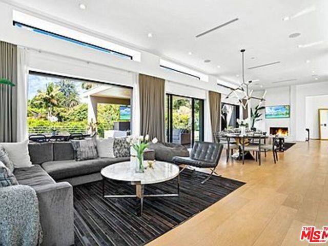 1085 Carolyn Way Beverly Hills, California Just reduced-Best Value for Newer Construction in City of BH. Vacation at home with light-filled living areas, and sliding walls of glass that flow effortlessly onto outdoor living spaces and true SoCal living. Thoughtfully re-imagined (2016) architectural smart home situated just north of Sunset on legendary Carolyn Drive delivers the perfect synergy of warmth and design brilliance. The open concept living space features wide plank floors, 12-foot ceilings, Fleetwood doors and clerestory windows, an open designer kitchen with Miele professional appliances overlooking the spacious outdoor living room. Retreat to the private MBR suite with spa-inspired bath area and spacious custom closet area. The lower level features a 4K home theatre, 3 ensuite bedrooms & office/gathering area that all open to a completely private outdoor sanctuary with covered entertainment area, grass yard, sparkling pool and spa. Just a few short minutes from restaurants, shopping. Also available for Lease $32,000/mo yearly