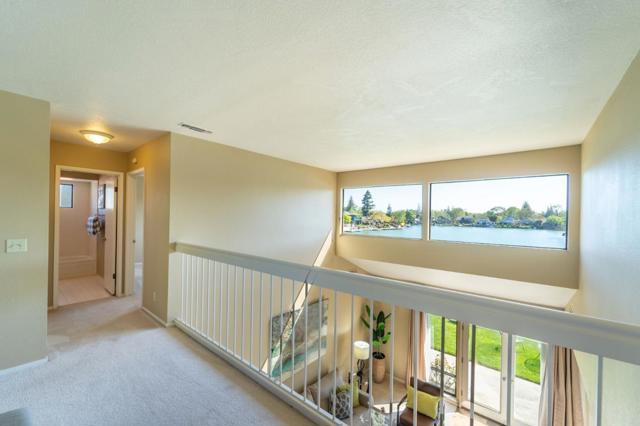 Catwalk on the 2nd floor where 3 bedrooms are located. 2 of them are facing the beautiful lake!