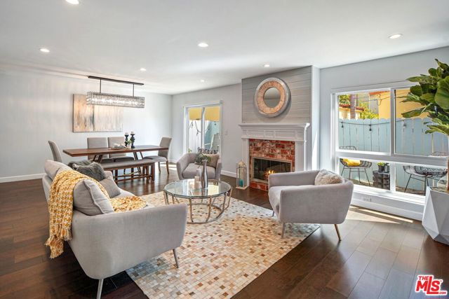 1118 17Th Street 3 Santa Monica, California Sophisticated, contemporary Santa Monica 3BR/2.5BA+loft townhome located in the highly coveted Franklin Elementary SMMUSD school district. Meticulously remodeled throughout in 2016, this spacious unit offers over 2000sf of luxurious living space plus a direct entry, private 2 car garage with extra storage. Open living/dining/great room with sliding doors leading out to large patio makes for the ultimate in indoor/outdoor living. Soaring ceilings and walls of glass provide incredible natural light throughout the home. Gourmet kitchen with stainless appliances, custom cabinets, quartz countertops, farm-sink, wine-fridge and walk in pantry. Sun-filled, elegant Master Suite boasts cathedral ceilings, custom closet with built-ins and a loft (ideal for gym or office). Loft includes huge closet and has French doors leading out to an exclusive roof top deck with expansive tree top views. Two other generous sized bedrooms round out the second floor. Additional features: Hardwood floors throughout, fireplace, updated beautiful bathrooms, inside laundry, central air conditioning, ample closet and storage space with built-ins. Unique, incredibly quiet and private property that feels like a HOME. Small boutique building with 5 units. HOA includes EQ insurance. Just a stones-throw from all the hip restaurants and shopping on Wilshire/Montana. Don't miss this very special property.