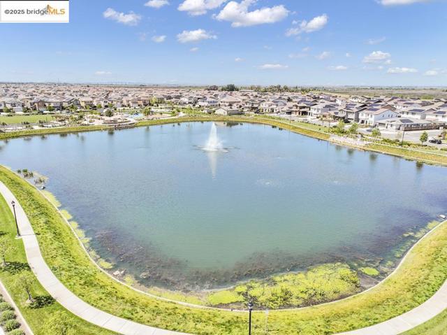 Aerial perspective of suburban area with a large body of water