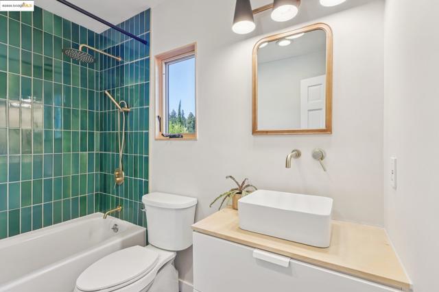Bathroom featuring vanity and shower / bath combination