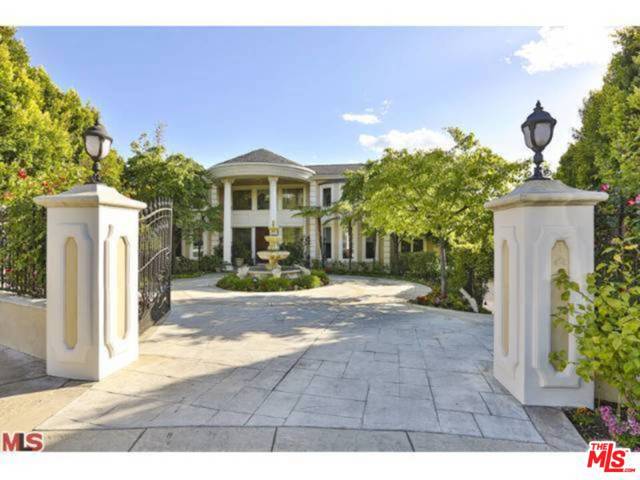 2243 Weybridge Lane Los Angeles, California Gated 24 hr Guarded Community of Bel Air Crest. Rare one acre estate available with privacy and canyon views out to the ocean. Close to 12,000 sq ft plus a guest/pool house. Custom built home ready to be reimagined. Custom built home with 7 bedroom suites and the primary bedroom with two baths and walk in closets. This home has an amazing floorplan w/spacious rooms, expansive glass windows, theater, game rooms, elevator, gourmet kitchen with flowing staircases. The front is graced with a motor court and home sits on an acre of land. Community has tennis courts, gym, club house, playground and putting green.