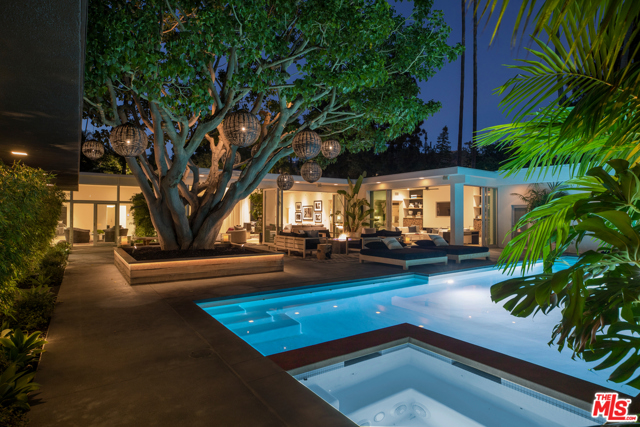 1007 Loma Vista Drive Beverly Hills, California The absolute quintessential Mid-Century Modern that has been completely restored and remodeled to perfection. Behind gates featuring a huge motorcourt, enter to high ceilings, walls of glass and a great open floor plan, beautiful walls for art, including a large double living room with bar, media room, a true gourmet kitchen with center island, an open family room, incredible master suite and much more. The entire house opens to an incredible outdoor living area, huge swimmer's pool and meandering paths of privacy. Stylish, chic, and completely private. Located on very prime lower Loma Vista in the best section of Trousdale, only minutes from downtown Beverly Hills. Shown to pre-qualified clients only. Hurry!