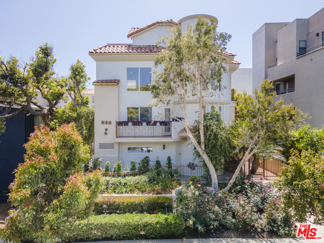 844 3rd Street A Santa Monica, California North East facing front unit, nestled between Montana Ave and the 3rd street Promenade, the Palisades Park and the beach beyond. This 3 story townhouse is filled with soft morning light pouring in from 2 story ceilings and roof top decks. Gently curving staircase takes you to mezzanine family room, 3 bed (and 3.5 baths) with additional terrace spaces creating the feel of a private home with in door/out door expanded living areas. 2 car private garage and underground gated parking with entry into the unit. Gleaming cherry hardwood floors throughout with double sided FP open to the LR, kitchen and dining. Leave your car at home, and enjoy this rare location..