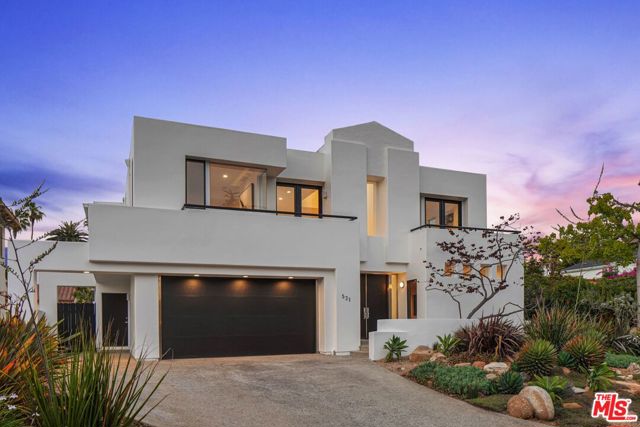 521 20Th Street Santa Monica, California Set within a highly desirable North of Montana neighborhood in Santa Monica, this five-bedroom retreat pairs a spacious, sun-drenched interior with generous outdoor space for a distinct California living experience. Beyond the formal entry with double-height ceilings and skylights, the main level reveals an expansive open living space with a living room and a family room, both complete with gas fireplaces, office, formal dining, and chef's kitchen featuring double ovens, walk-in pantry, warming drawer, and a breakfast nook. Up a grand staircase steeped in natural light, discover four bedrooms, inclusive of the primary suite. Via a double-door entry, the primary suite opens to a spacious sitting room and stunning bedroom with dual closets, dressing area, balcony and a spa-like bath with dual sinks, large glass enclosed shower and jetted soaking tub. Beyond the home's interior, find a covered and open-air patio space, pool and spa, built-in barbecue and a grassy turf lawn. Set just moments from Santa Monica's coveted attractions and amenities, this 20th Street retreat offers the ultimate in modern coastal living. OFFERS DUE: THURSDAY, 7/15 AT 5:00PM.