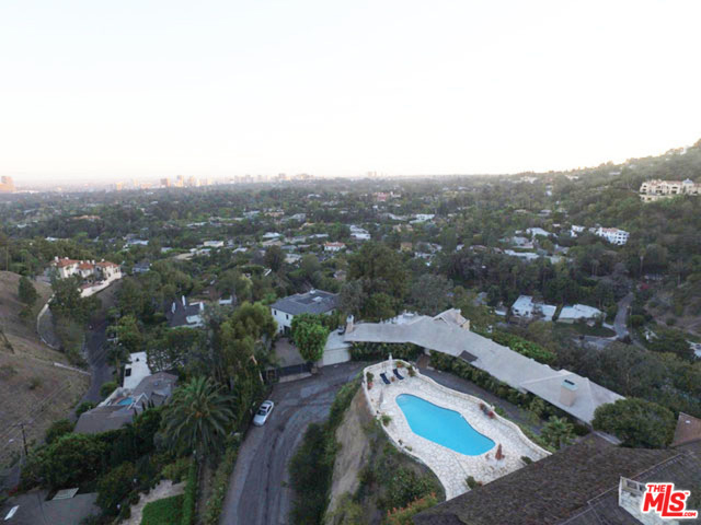 1326 Beverly Estates Drive Beverly Hills, California Panoramic views and exceptional development opportunity! Priced to sell! Designed by Renowned M- Rad Architecture firm, this stunning architectural masterpiece features walls of glass that showcase the stunning views. Permitted plans over 9000 SQFT with 5 Bedrooms and 6 Bathrooms. A refreshing take on contemporary design, utilizing 4 separate indoor/outdoor courtyards, yoga decks, outdoor lounges, double height ceilings, and masterfully designed dramatic pool with wrap around decks. An incredible opportunity to build on one of the best promontories in BHPO!